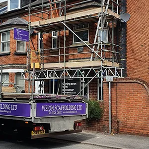 company van next to scaffolding