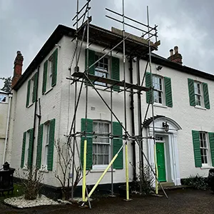 white house with green windows