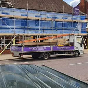 zoomed out view of scaffolding and van