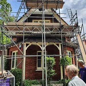 scaffolding around small round building